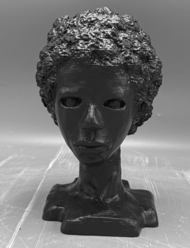 Sculpture of a girl's head. She has textured short hair and no pupils in her eyes.