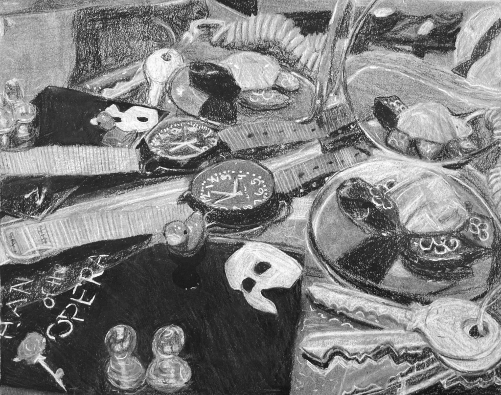 Charcoal drawing of many different small objects, possibly in front of a mirror. Objects include a watch, keys, and a tiny duck.
